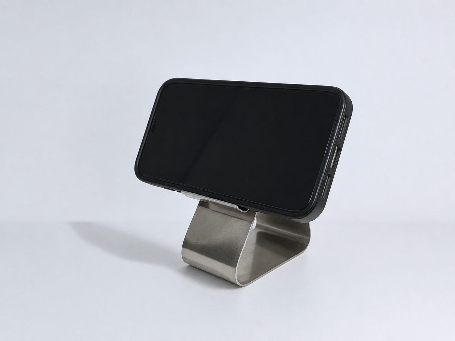 GIDE phone stand holding a phone